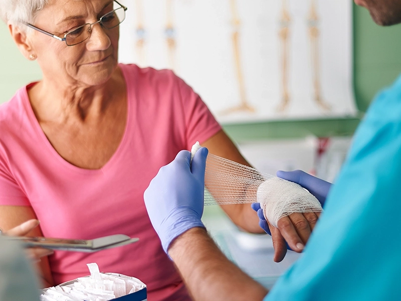 woman with wound and gauze